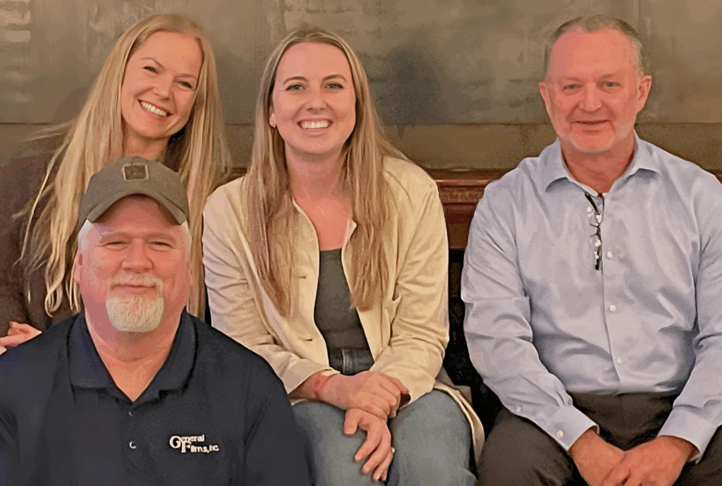 Team photo of staff members from General Films Bag-in-Box. The team is sitting and smiling at the camera.